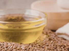 Welke natuurlijke oliën of coatings beschermen een houten buitenkeuken duurzaam